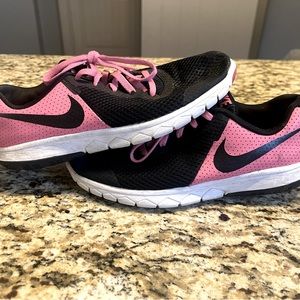 Nike running shoe. Size 4.5Y black/pink. Used. Normal wear